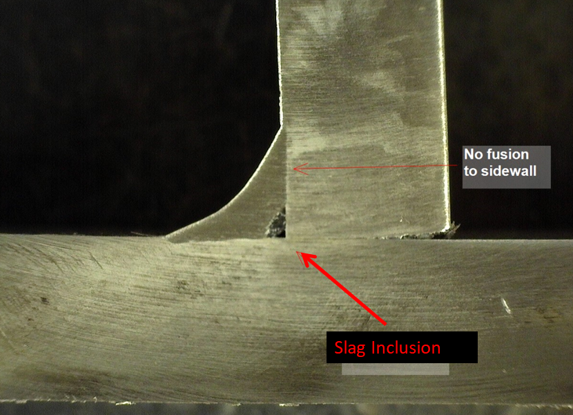 Welding processes such as SMAW and FCAW are susceptible to slag inclusions. Slag inclusions prevent proper fusion and can have sharp ends which creates a crack-like behavior.